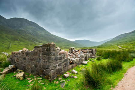 Along the West Highland Way. A ruined farmhouse in the highland moor stands on the edge of the...