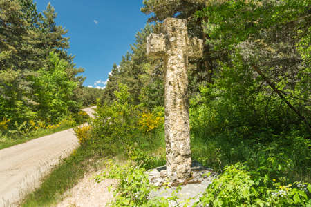 A stone cross on the pilgrimage path of Saint Guilhem le Desertの写真素材