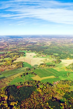 Aerial view of autumn rural landscape under blue skyの写真素材