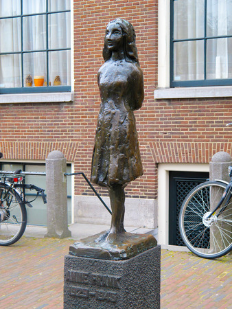 AMSTERDAM, NETHERLANDS-MARCH 13, 2011: Anne Frank statue in front of Anne Frank Museum in Amsterdam. A victim of Nazi Germany in World War 2 she wrote a diary of her short life before she was killed.のeditorial素材