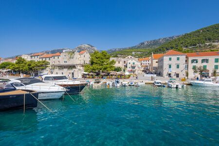 BOL, CROATIA - AUGUST 2019 Bol Center on Brac Island approached by the turquoise colored sea 1647