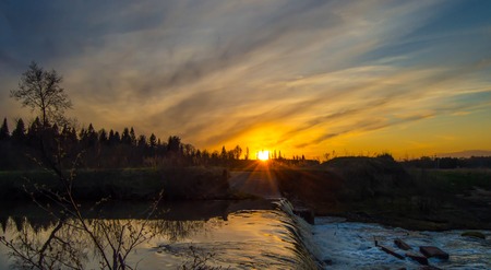 River at sunset beautiful waterfall on the rocksの写真素材