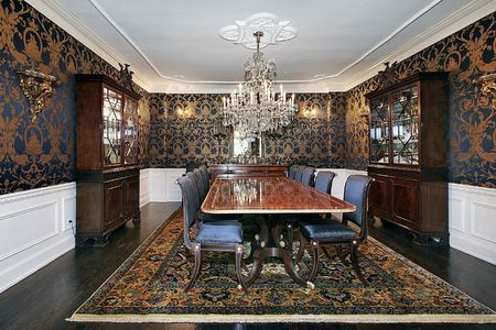 Traditional dining room with buffet and designs on wallsの写真素材