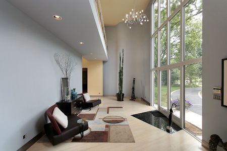 Modern foyer with two story window and sitting areaの写真素材