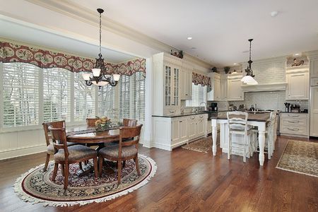 Modern kitchen with eating area and outside viewの写真素材