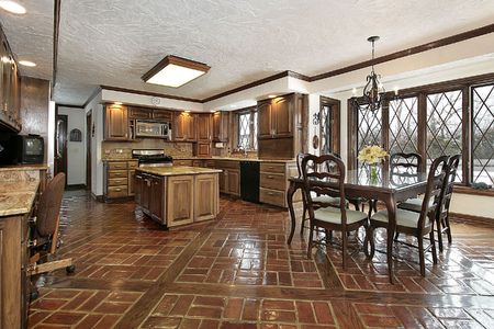 Large kitchen in earth tones with eating areaの写真素材