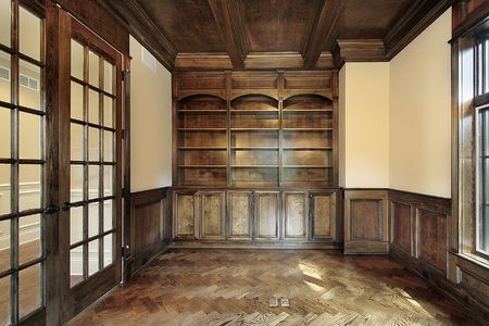 Library in new construction home wtih brown panelingの写真素材