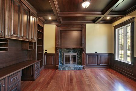 Library in luxury home with cherry wood panelingの写真素材