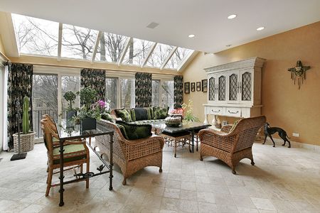 Living room with skylights and wicker furnitureの写真素材