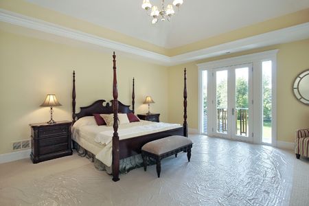 Master bedroom in new construction house with plastic on carpetの写真素材