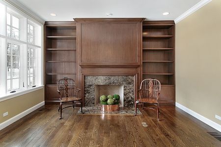 Library in new construction home with fireplaceの写真素材