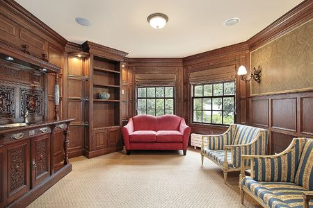 Library in luxury home with red sofaの写真素材