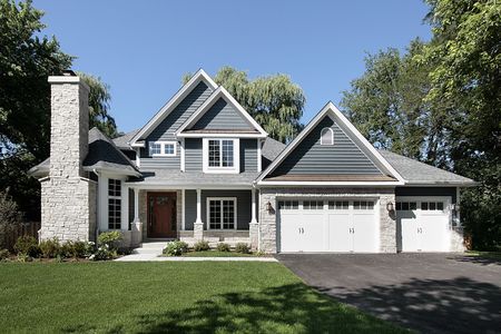 Front view of luxury home with stone fireplaceの写真素材