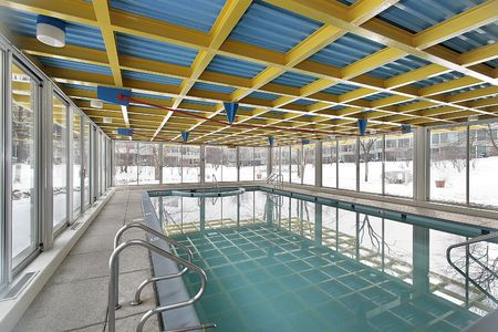 Large indoor swimming pool in condominium complexの写真素材