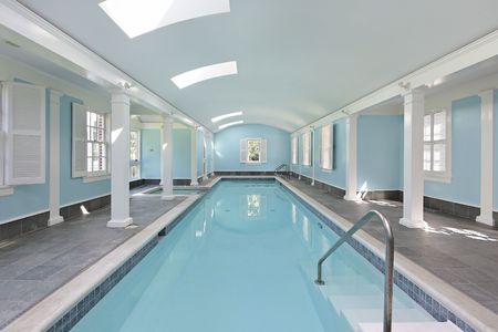 Long indoor swimming pool in luxury homeの写真素材