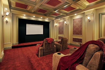 Theater in luxury home with plush red carpetingの写真素材