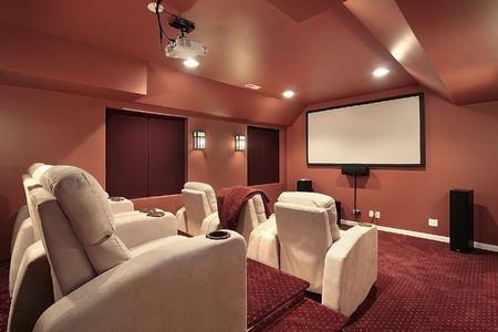 Luxurious theater in upscale home with red wallsの写真素材