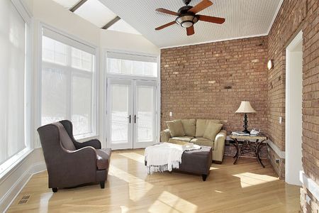 Sun room with windows and brick wallの写真素材