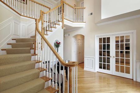 Foyer in luxury home with wood staircaseの写真素材