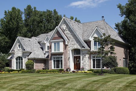 Luxury brick home in suburbs with cedar shake roofの写真素材