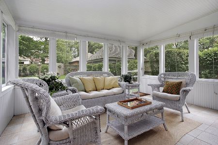 Porch in luxury home with wicker furnitureの写真素材
