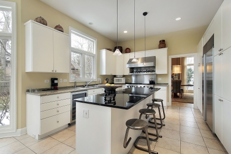Kitchen in luxury home with marble and black islandの写真素材