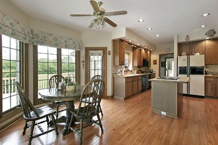 Kitchen in luxury home with eating areの写真素材