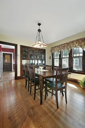 Wood paneled dining room with stained glassの写真素材