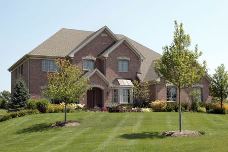 Luxury brick home in suburbs with arched entryの写真素材
