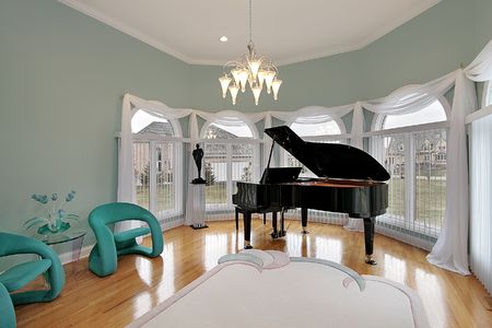 Music room in luxury home with green chairsの写真素材