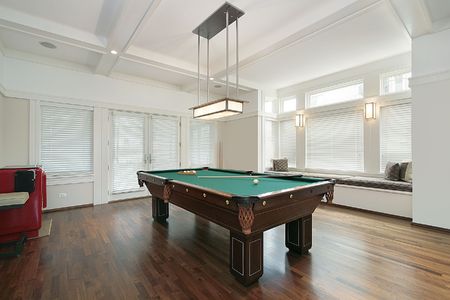 Pool room in luxury home with wall of windows