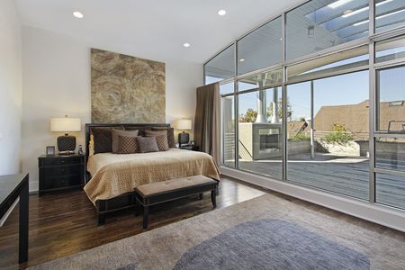 Master bedroom in luxury home with large deckの写真素材