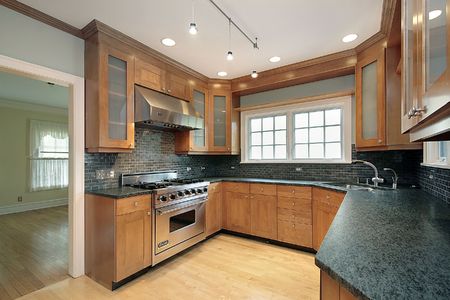 Kitchen in luxury home with granite countersの写真素材