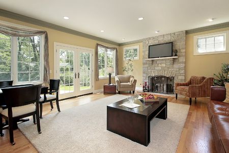 Family room in new construction home with stone fireplaceの写真素材