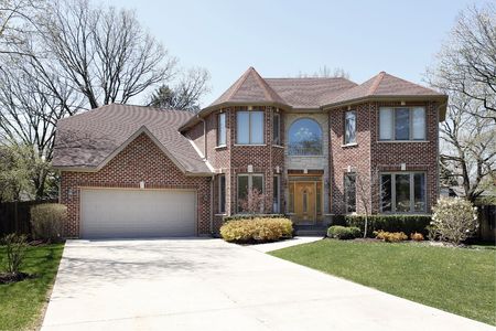 Luxury brick home in suburbs with stone entrywayの写真素材