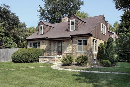 Brick home in suburbs with stone entryの写真素材