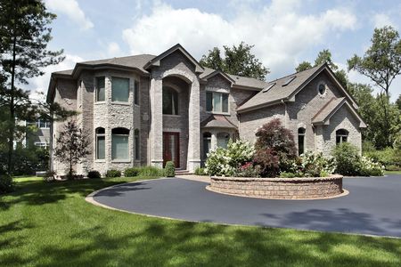 Luxury brick and stone home with arched entryの写真素材