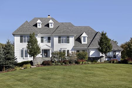 Large home in suburbs with white sidingの写真素材