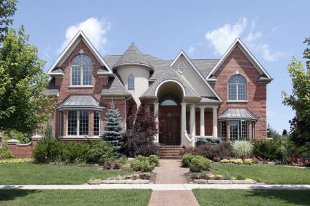 Luxury brick home with turret and arched entryの写真素材