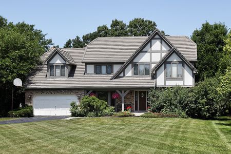 Tudor home in suburbs with front porchの写真素材