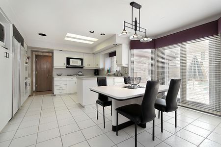 Kitchen in suburban home with white tileの写真素材