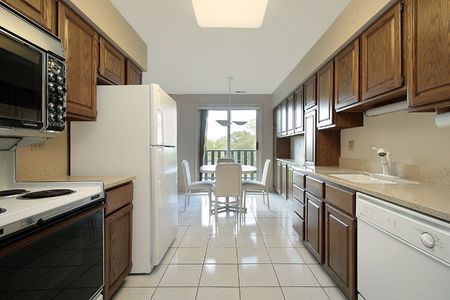 Kitchen in suburban condo with eating areaの写真素材