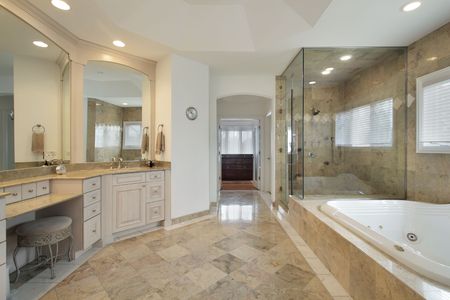 Master bath in luxury home with glass showerの写真素材