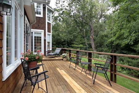 Large wood deck with forest in luxury home