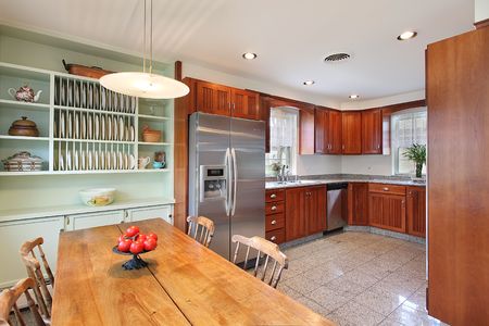 Kitchen in suburban home with eating areaの写真素材