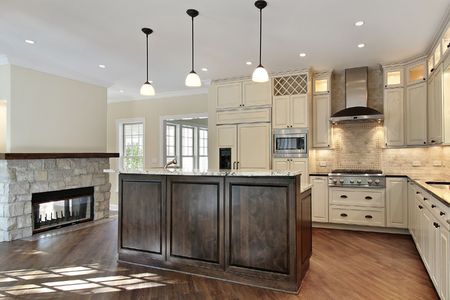 Kitchen in new construction home with stone fireplaceの写真素材