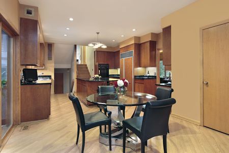 Kitchen in luxury home with wood paneled refrigeratorの写真素材