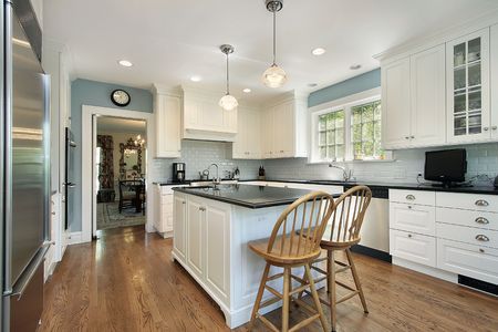 Kitchen in suburban home with white cabinetryの写真素材