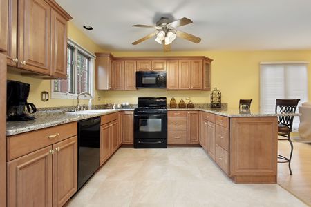 Kitchen in suburban home with black appliancesの写真素材