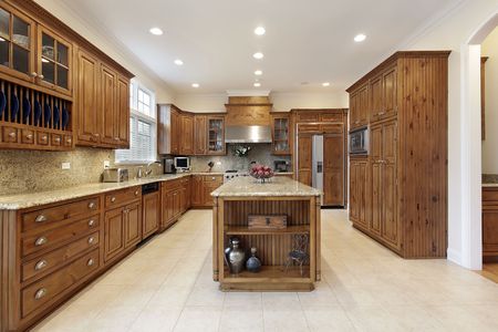 Kitchen in luxury home with granite islandの写真素材